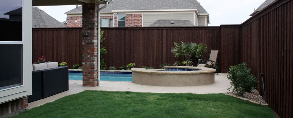 Wooden Fence Near Garden With Pool